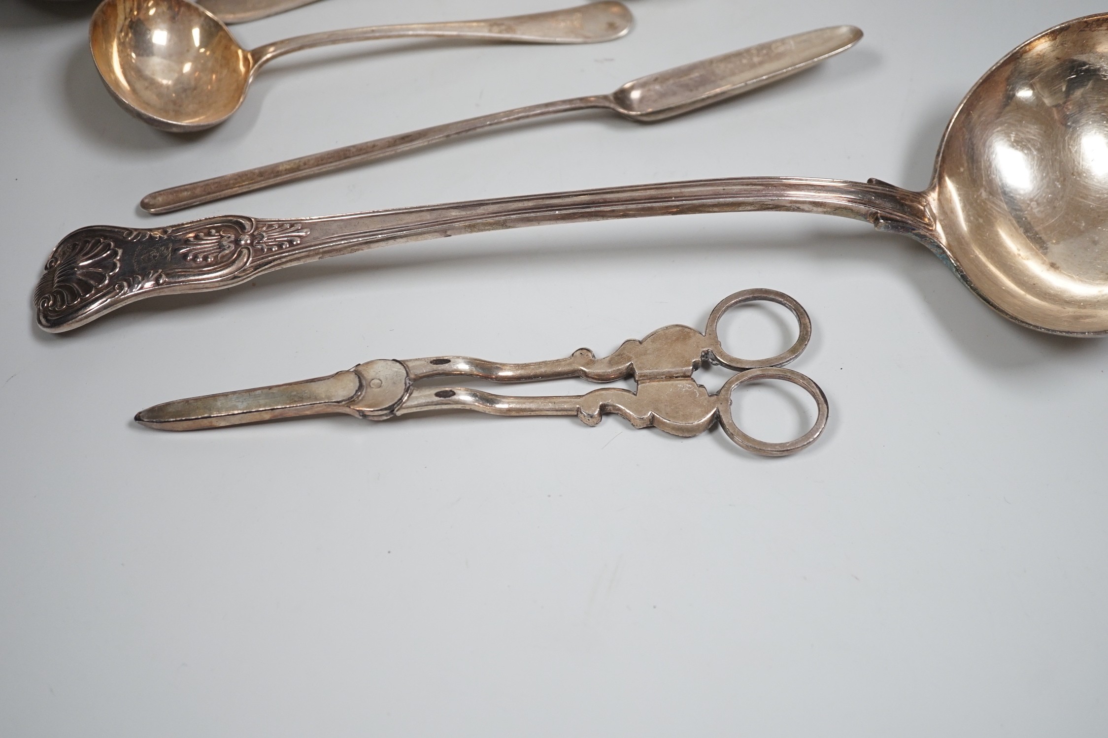 Mixed silver and plated ware including a Victorian silver Kings pattern soup ladle, London, 1857, a George III silver marrow scoop, London, 1789, a pair of later Old English pattern sauce ladles, a sterling bonbon dish,